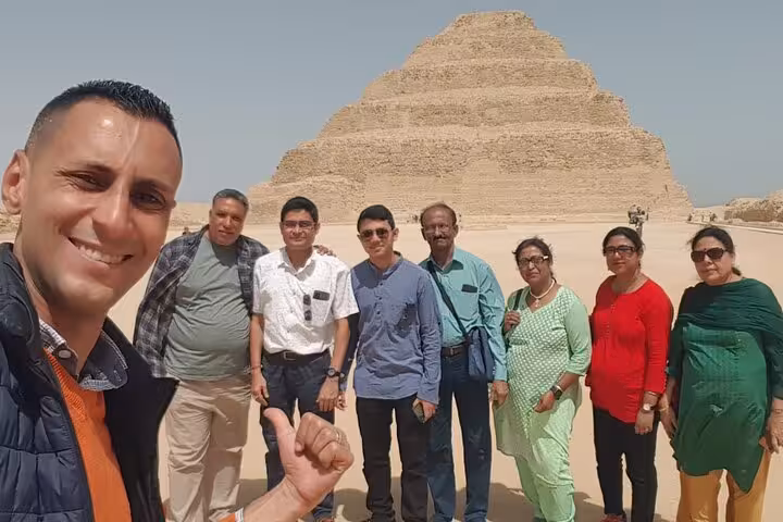 Visitors smile for a photo at the Step Pyramid of Djoser, part of the Private 3 Days Tour in Egypt.