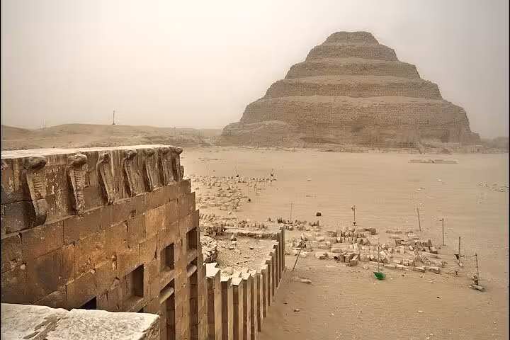 Step Pyramid of Djoser at Saqqara seen from ancient tomb ruins on a Cairo private tour with lunch