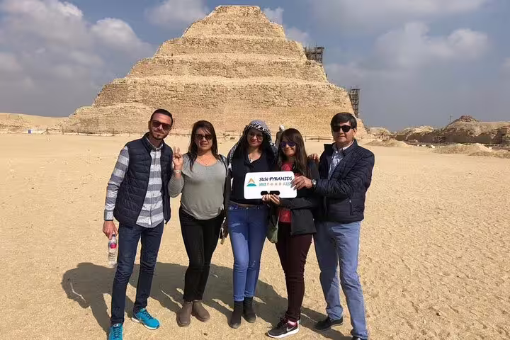 Group photo at the Step Pyramid of Djoser in Saqqara on private guided tour from Cairo with lunch and transfers
