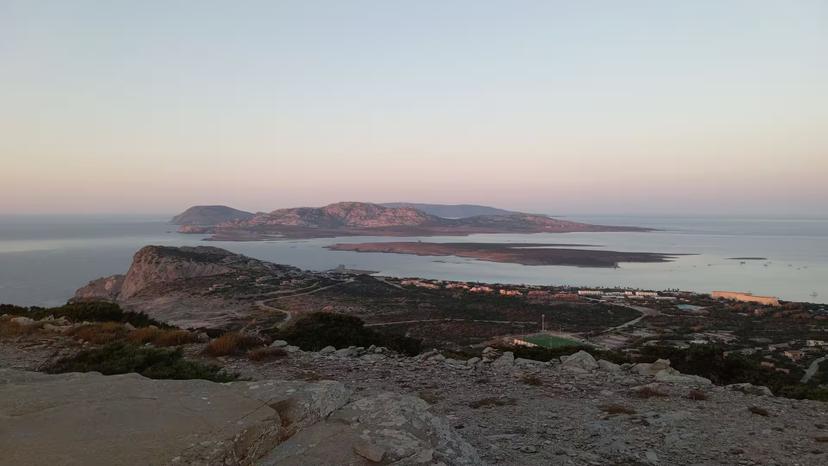 Scenic view of Capo Falcone with a stunning sunset over Stintino coastline, ideal for a sunset hike and tasting tour.