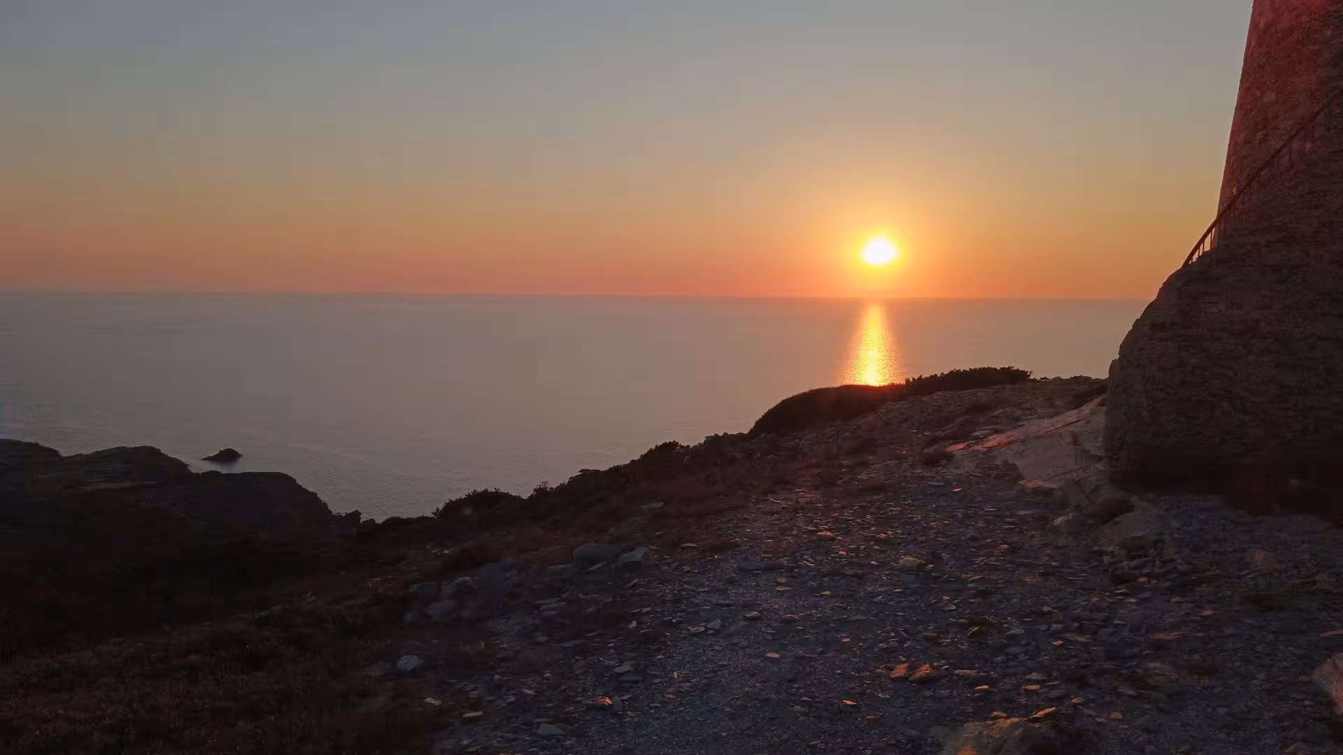 Captivating sunset view over Capo Falcone, Stintino, highlighting a scenic hike and tasting experience.
