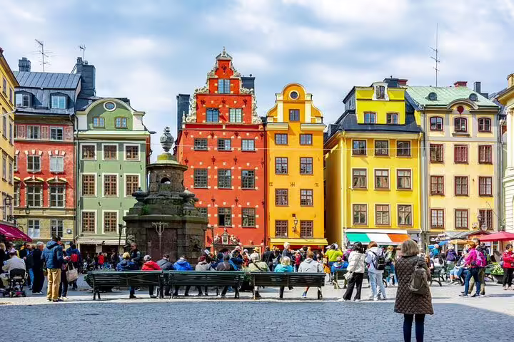 Stortorget square in Gamla Stan Stockholm, colorful houses and crowds on a self-guided e-scavenger hunt