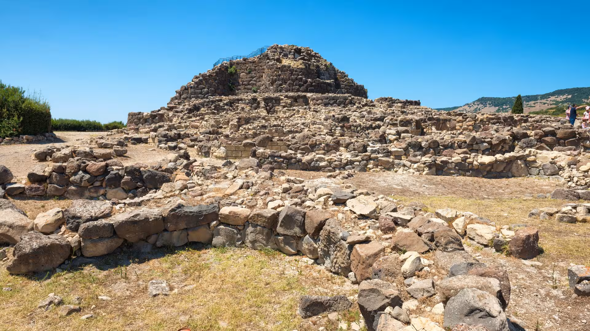 Explore the ancient stone ruins of Su Nuraxi di Barumini, a UNESCO World Heritage site in Sardinia's scenic landscape.