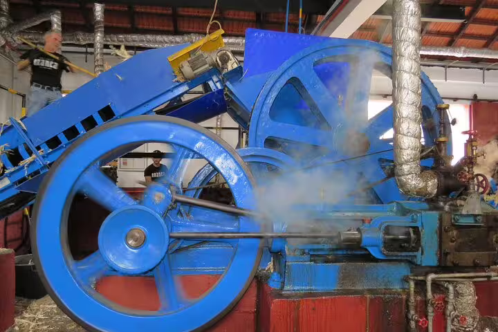 Vintage machinery in a traditional sugarcane factory on a full-day guided tour showcasing the cultural heritage of Northeast Madeira.
