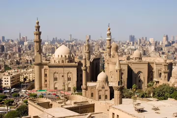 Panoramic view of Sultan Hassan Mosque and Cairo skyline on Islamic and Coptic Cairo private tour with lunch