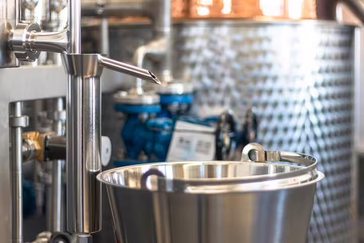Close-up of a modern rum distillery with stainless steel equipment, highlighting the craftsmanship in the Sunny Southwest tour.