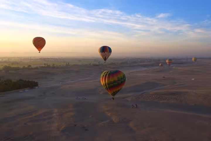 Sunrise hot air balloon flight over desert dunes, lifetime experience tour with panoramic aerial views