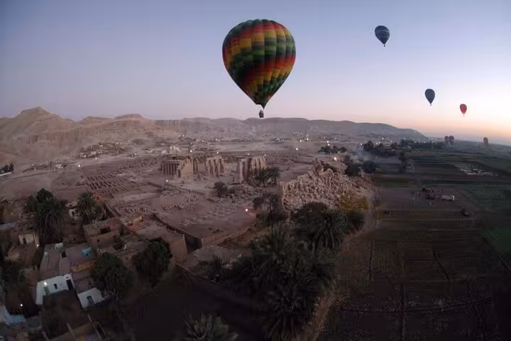 Sunrise VIP hot air balloon ride in Luxor over West Bank ruins and Nile fields with hotel transfers
