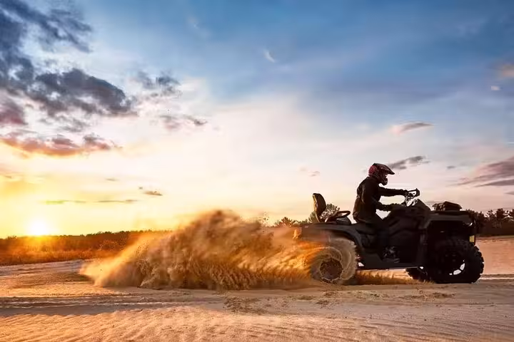 Sunset ATV quad ride in Sharm El Sheikh desert, sand spray adventure before Bedouin dinner and stargazing
