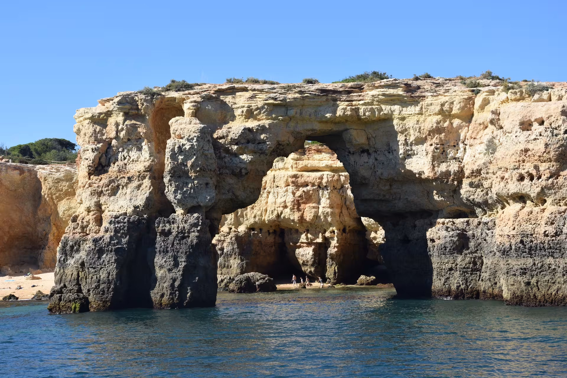 Discover the majestic sea arches and rugged cliffs of the Algarve coast, a highlight of the Benagil Caves tour.