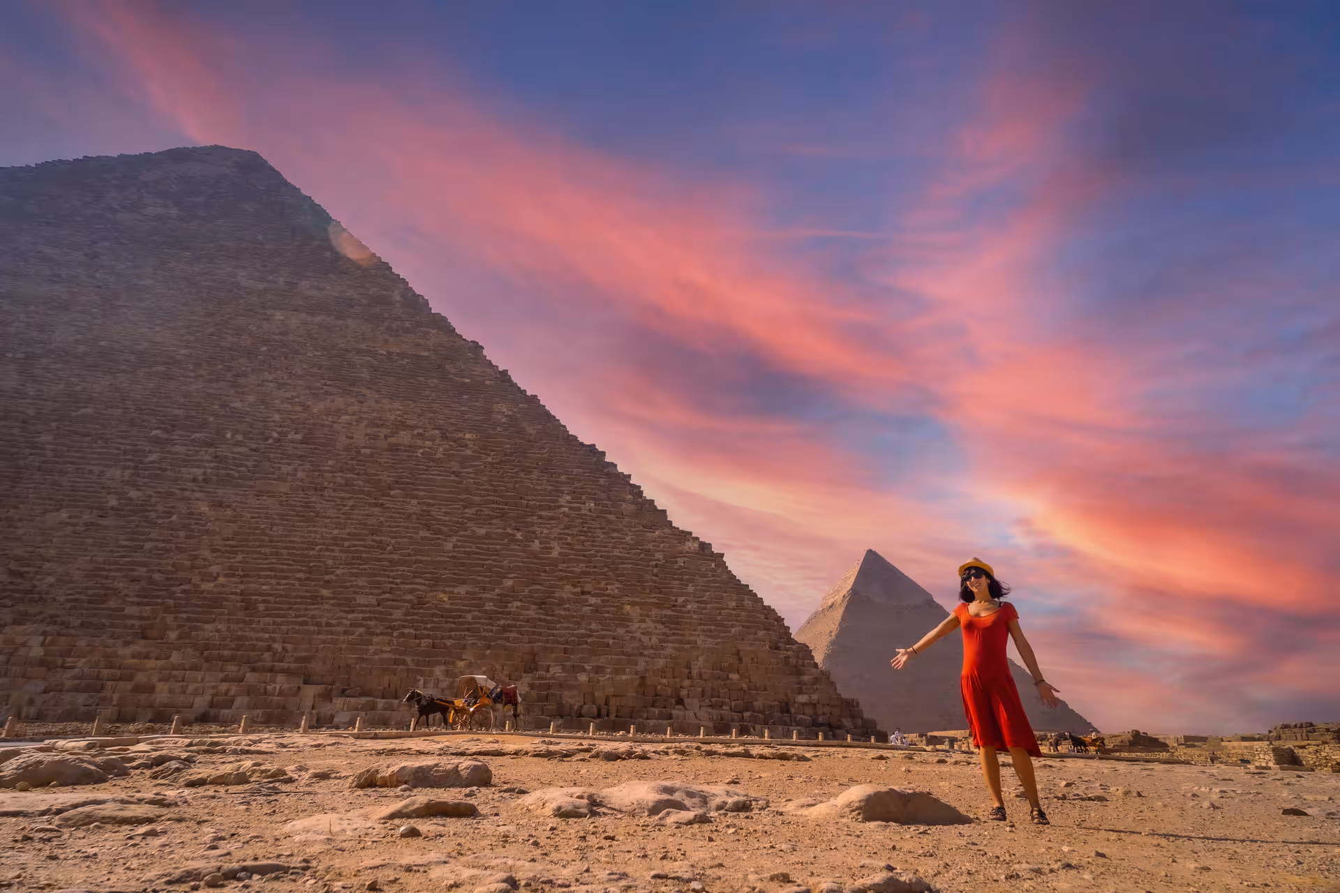 Sunset at the Great Pyramid of Giza with traveler on private Cairo day tour, pyramids visit after Grand Egyptian Museum