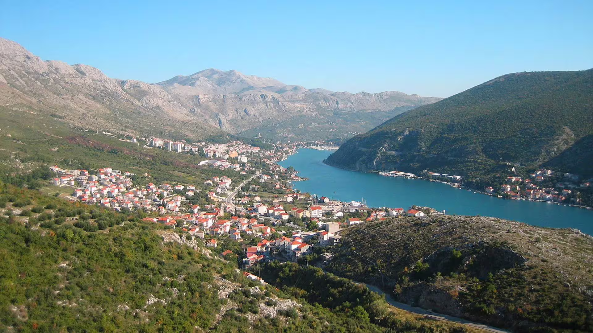 Sunset Panoramic Drive viewpoint over Kotor Bay, red-roof town and mountains along the Adriatic coast