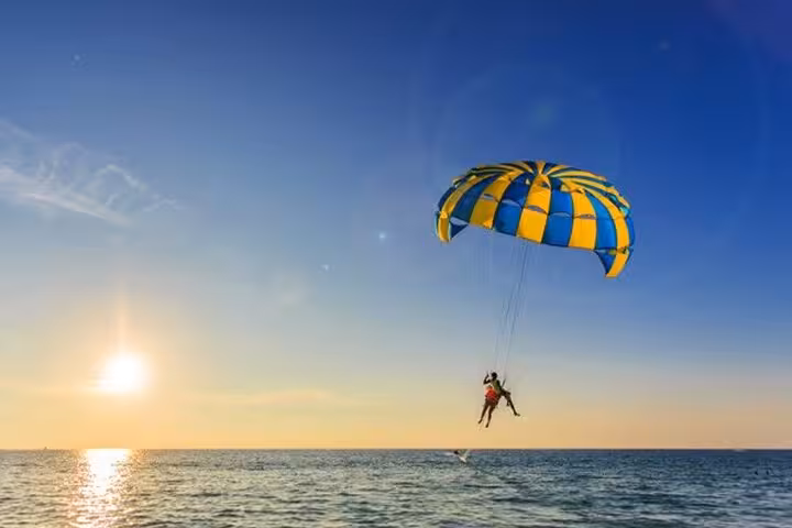 Sunset parasailing experience in Sharm El Sheikh over the Red Sea, tandem flight with private transfer