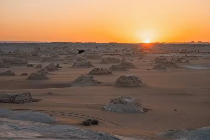 Sunset over White Desert chalk formations on 3 Days Eco Bahariya Oasis Camping Tour from Cairo