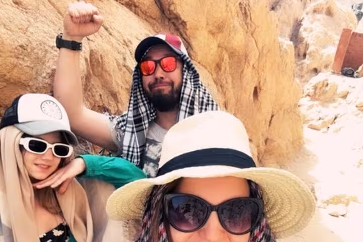 Tourists selfie in Super Colored Canyon on jeep adventure from Sharm El Sheikh, Sinai desert rocks