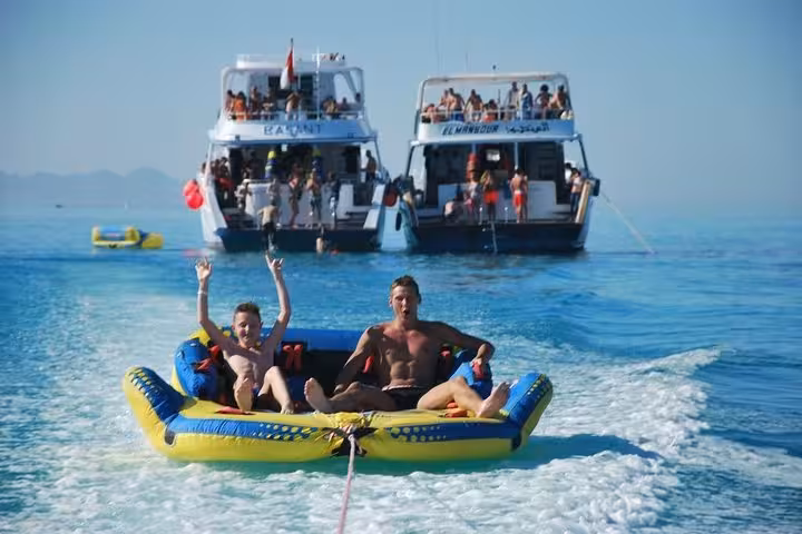 Super Giftun Island adventure with banana boat tow ride behind yachts on the Red Sea, fun water sports