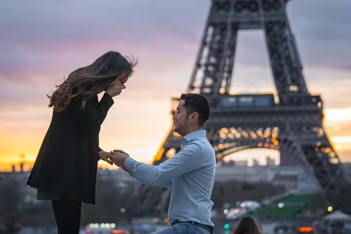 Surprise Eiffel Tower proposal at sunset, Paris engagement photographer capturing the kneeling moment