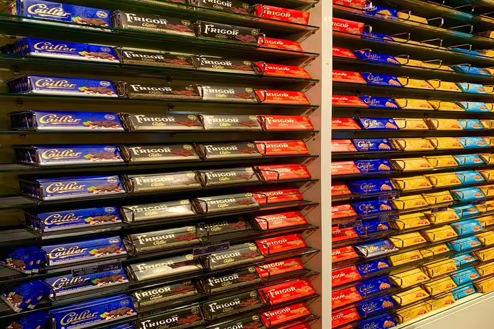 Vibrant display of assorted Swiss chocolate bars at a local shop, highlighting the rich flavors of the region.
