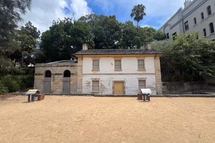 Historic sandstone building in Sydney surrounded by lush greenery, ideal for a private city tour experience.