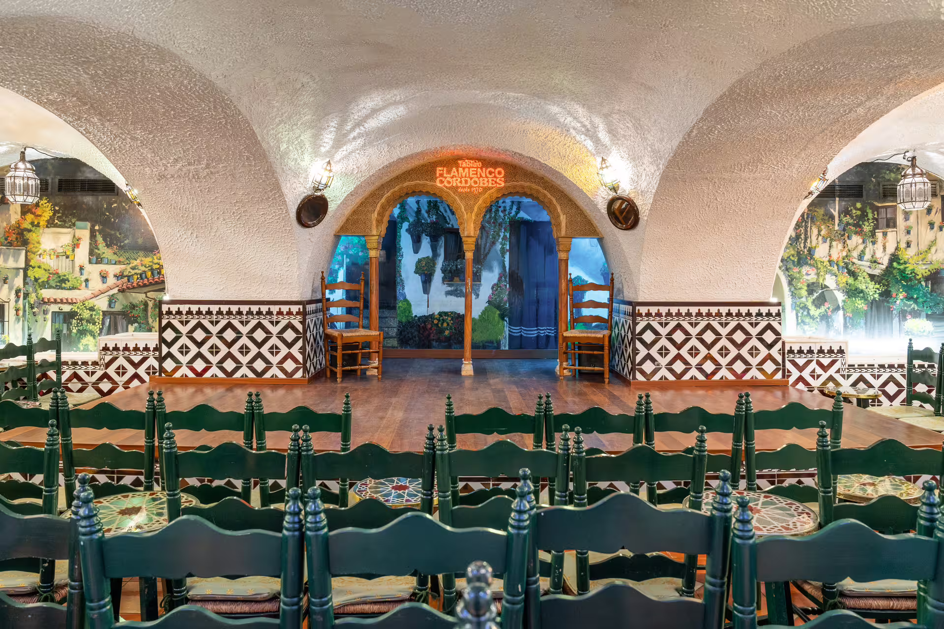 Interior view of Tablao Cordobes in La Rambla showcasing its traditional Spanish decor and performance stage.