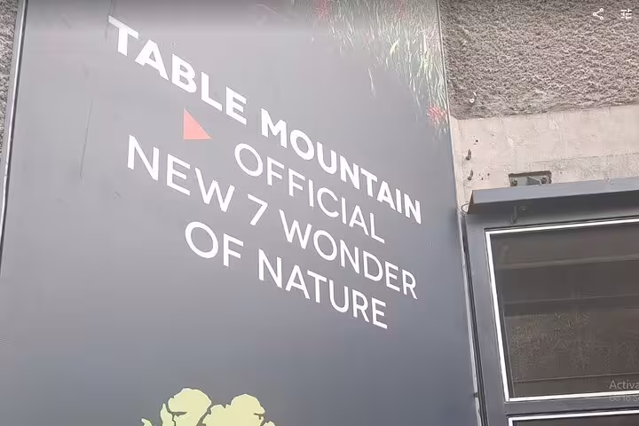 Signboard at Table Mountain entrance highlighting its status as an official New 7 Wonder of Nature.