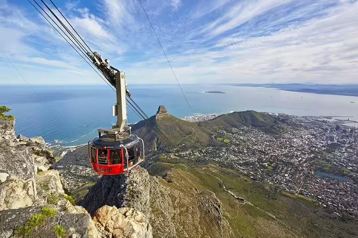 Breathtaking aerial view from Table Mountain cable car overlooking Cape Town and the ocean.