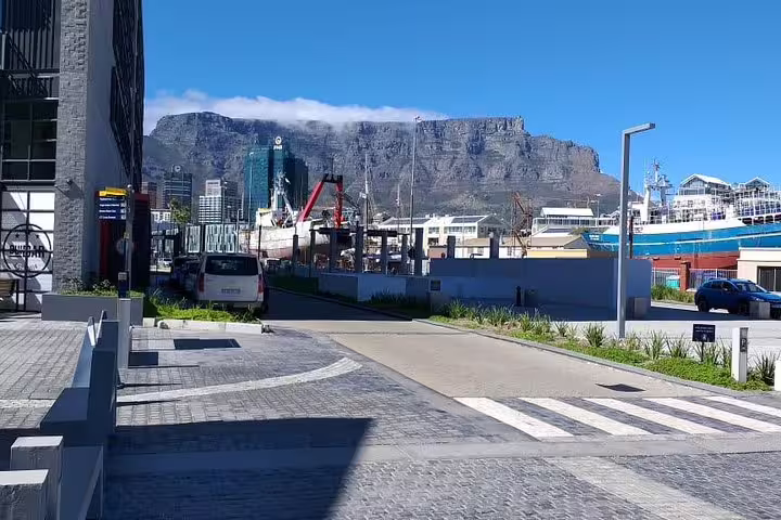 Scenic view of Table Mountain from Cape Town's harbor area, featured in the Cape Town City guided tour.