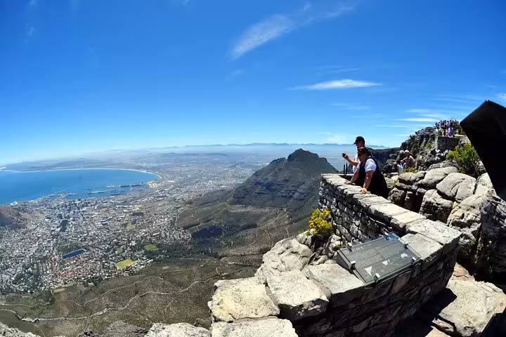 Stunning panoramic view from Table Mountain summit overlooking Cape Town, part of the iconic tour including Boulder Beach and Cape Point.