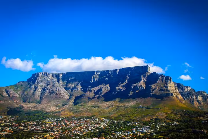 Majestic view of Table Mountain with a clear blue sky over Cape Town, ideal for scenic hikes and exploration.