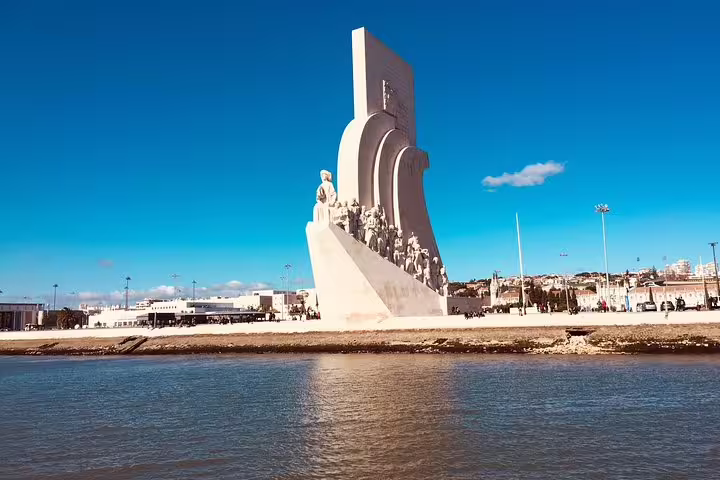 Padrão dos Descobrimentos monument viewed from the Tagus River on a sunny Lisbon sailing tour.