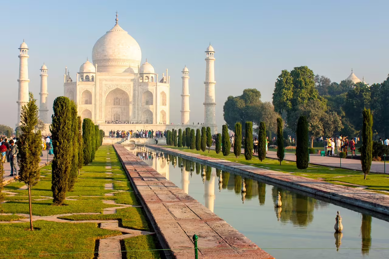 Iconic Taj Mahal reflected in serene waters, a must-visit on the Complete Rajasthan 14-day tour.