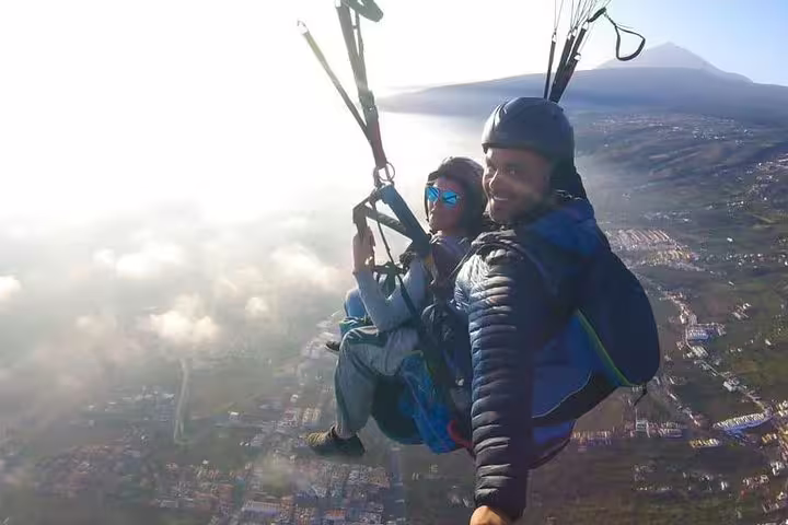 Soaring high above the clouds, this tandem paragliding experience provides stunning vistas at 2250 meters elevation.