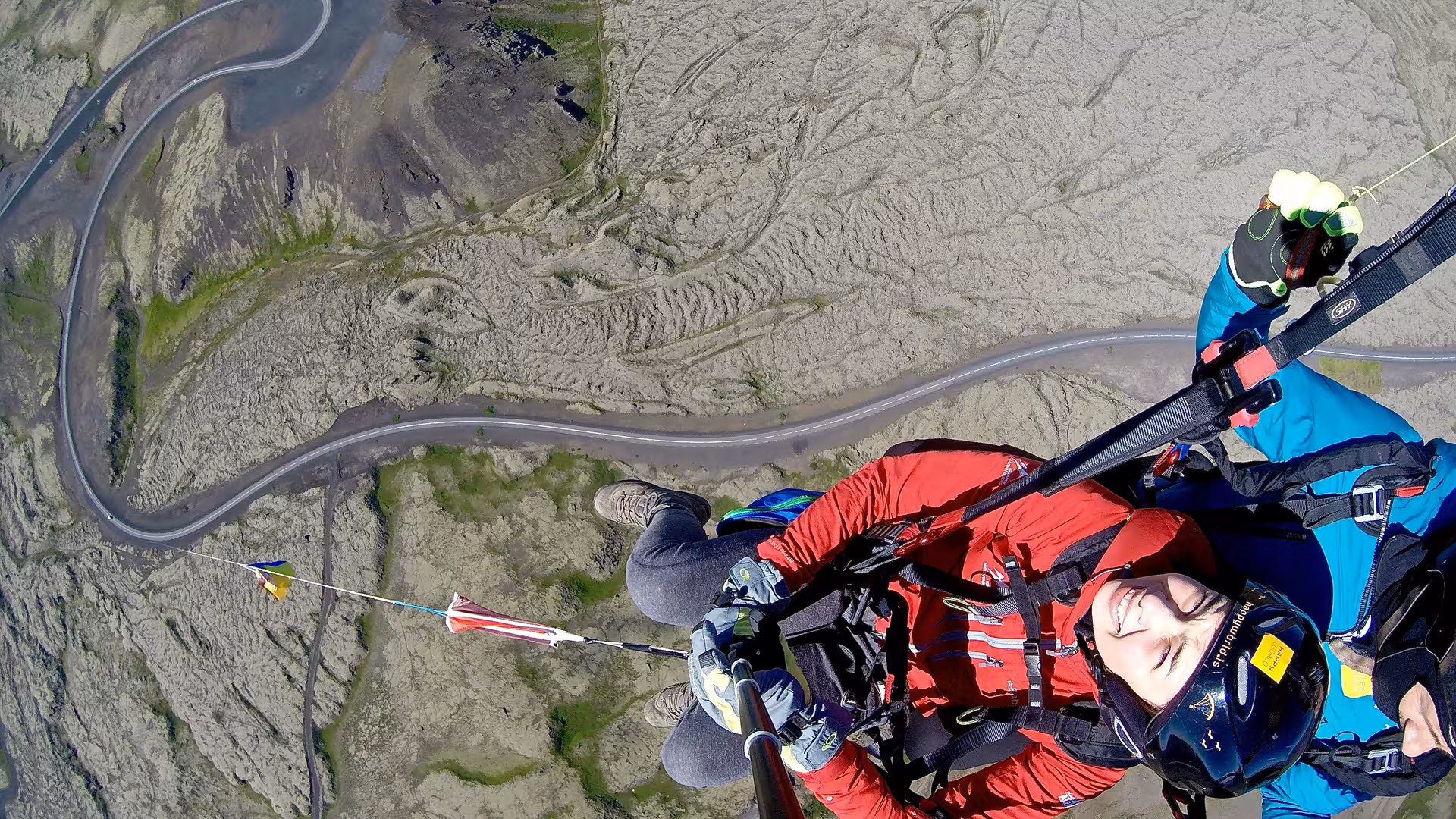 Tandem paragliding over Blue Mountains lava fields, panoramic volcanic landscape and ocean views in Iceland