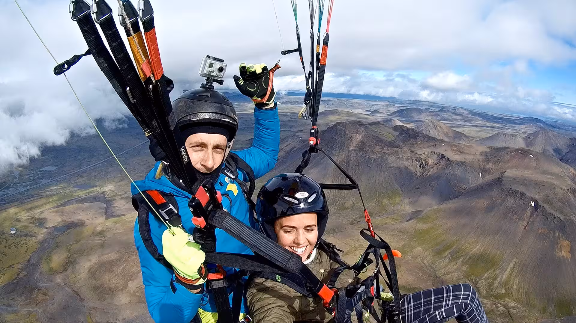 Sunset tandem paragliding takeoff at Blue Mountains over rugged lava fields, epic adventure flight tour