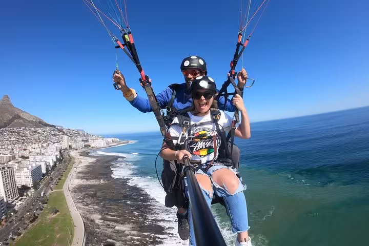 Soar above Cape Town's scenic coastline with tandem paragliding, capturing spectacular ocean and city views.
