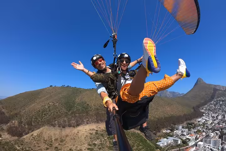 Exhilarating tandem paragliding in Cape Town with breathtaking views of mountains and the ocean.