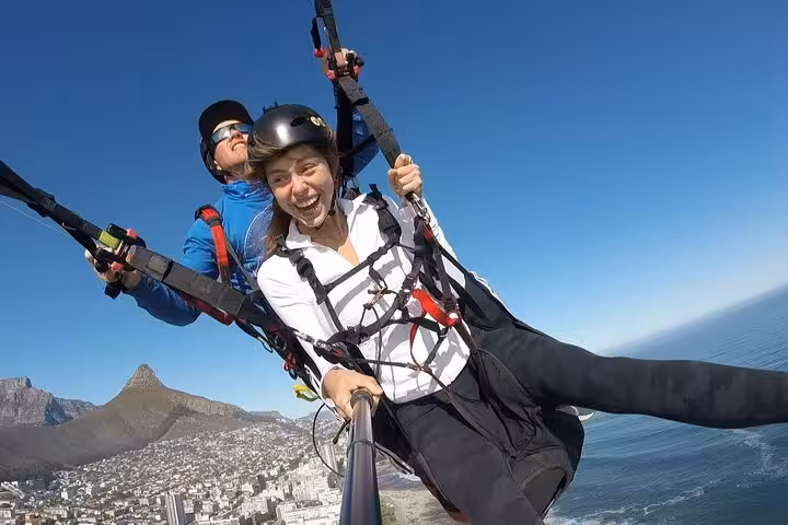 Experience thrilling tandem paragliding over Cape Town with stunning ocean and mountain views.