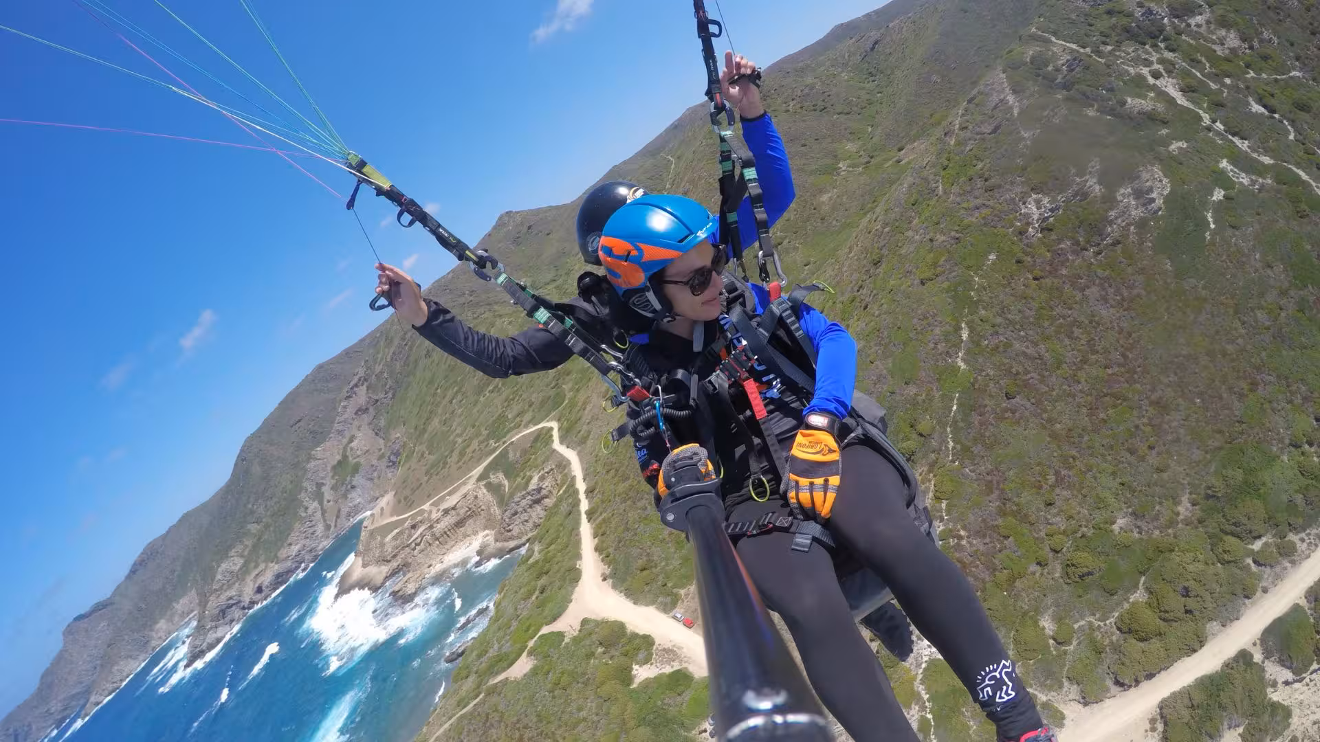 Experience tandem paragliding over Littigheddu's stunning coastline with breathtaking views of cliffs and sea.