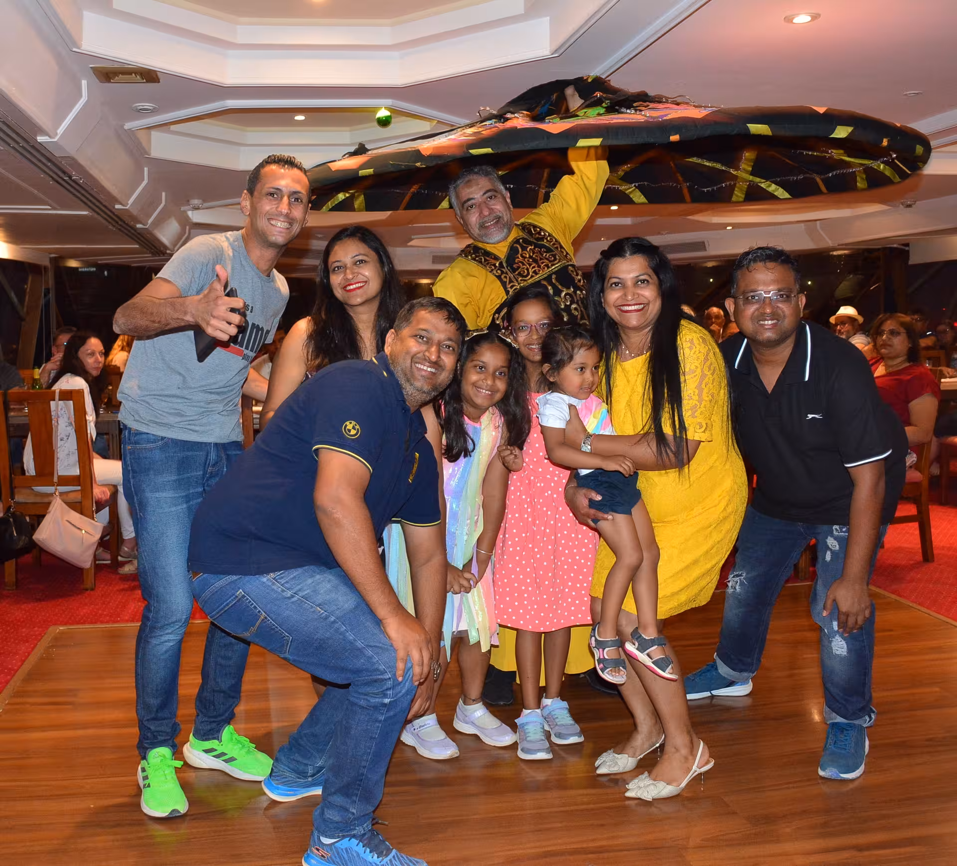 Guests enjoying a vibrant Tanoura dance performance on a Nile river cruise in Cairo during the Egypt Golden tour.