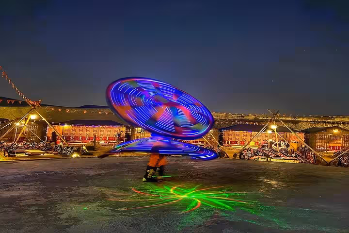 Tanoura dancer spins LED skirt at Giza Bedouin camp show, part of VIP Arabian Night dinner with free photographer