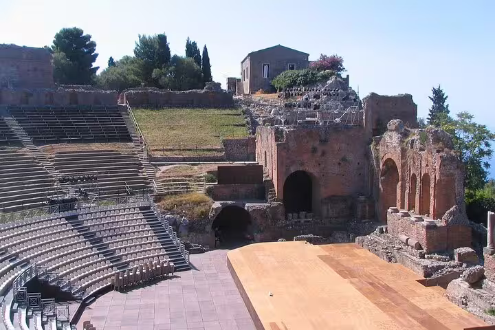 Wide view of Taormina’s ancient Greek Theatre seating and stage, a highlight stop on the 2-hour private sightseeing tour in Sicily