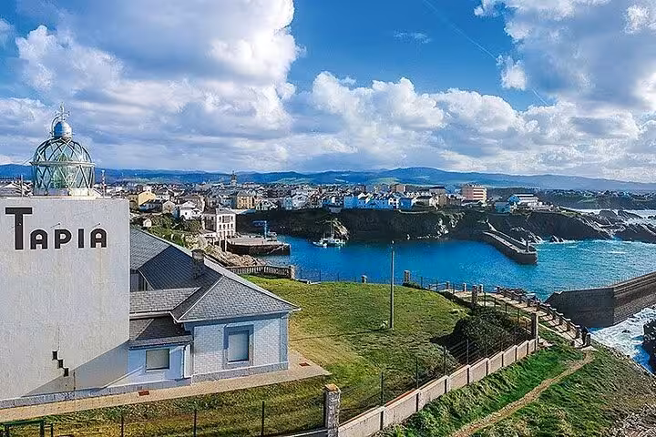 Panoramic view of Tapia de Casariego overlooking the rugged coastline and vibrant blue sea in Asturias, Spain.