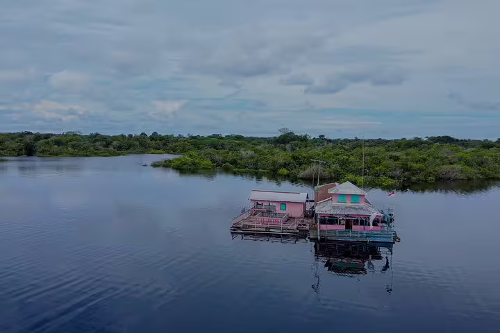 Scenic floating lodge on Rio Negro river, offering serene views and adventure at Tapiri Rio Negro Lodge tour.