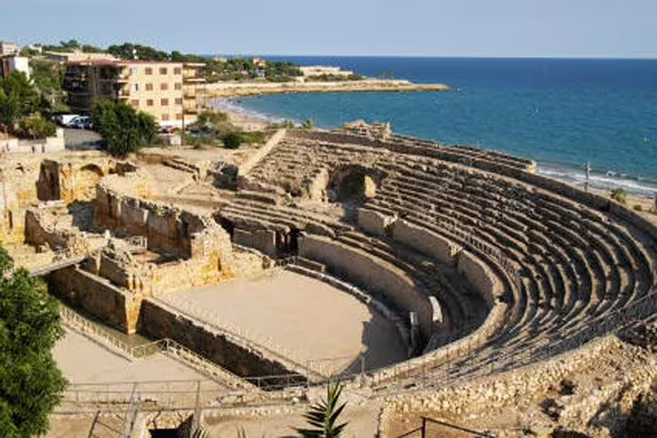 Explore Tarragona's ancient Roman amphitheater with stunning sea views on this immersive historical tour.
