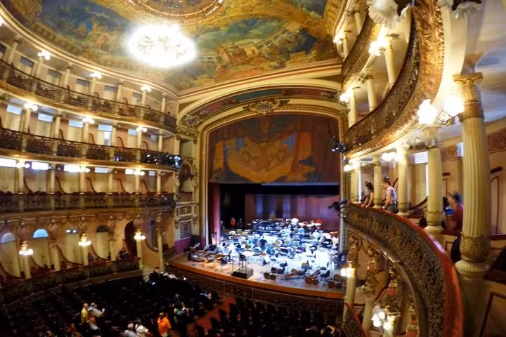 Opulent interior of Teatro Amazonas in Manaus with balconies and orchestra setup on a guided city tour