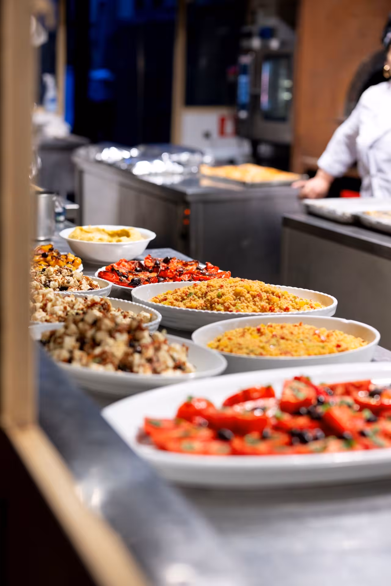 Buffet dishes at Teatro del Sale Florence dinner show, featuring Tuscan salads and roasted vegetables