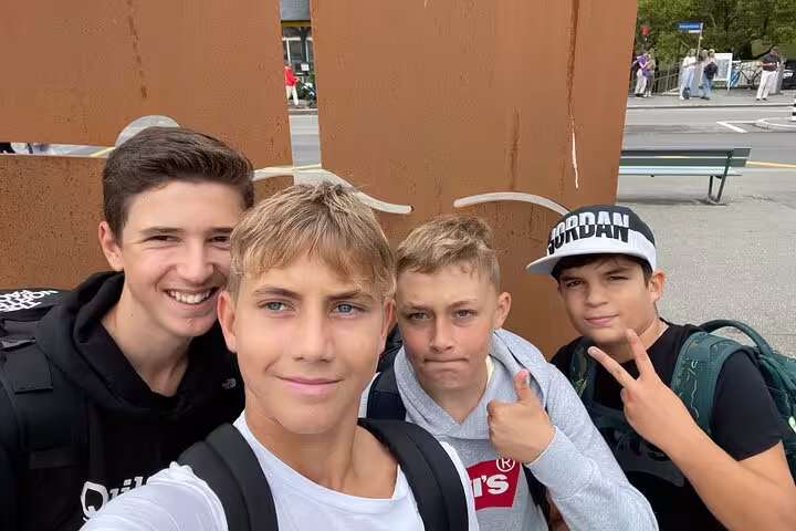 Teen group selfie on Bern scavenger hunt, exploring city landmarks on a fun self-guided tour in Switzerland