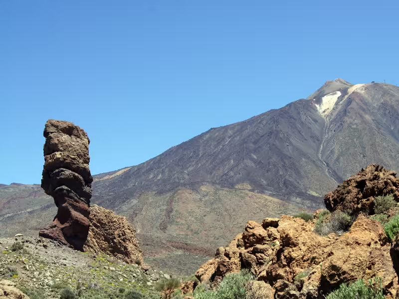 Majestic Teide National Park landscape in Tenerife, featuring unique rock formations under a clear blue sky.