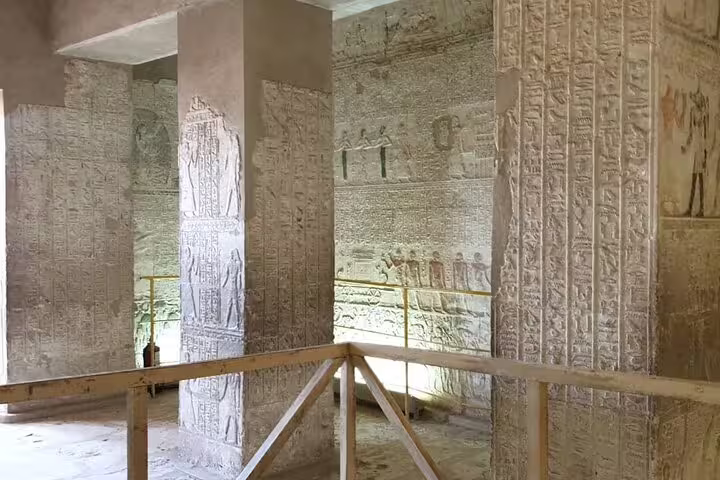 Interior hall with hieroglyph-covered pillars and reliefs, Tel El Amarna on a private 2-day tour from Cairo