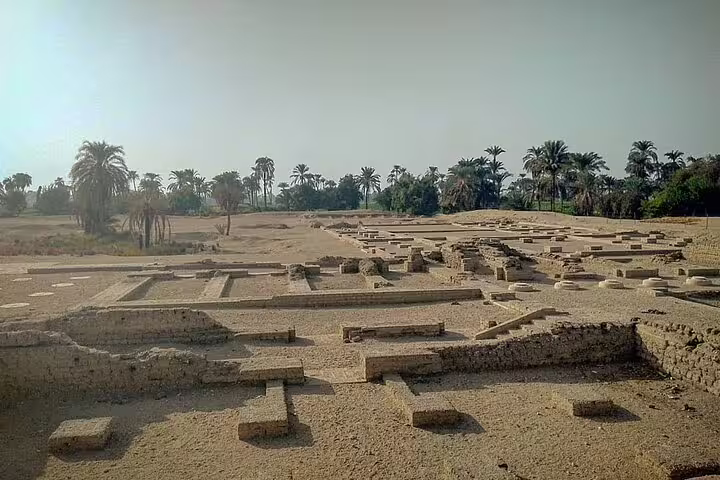 Tel El Amarna ruins in El Minya, ancient city foundations and palm-lined desert on a 2-day tour from Cairo